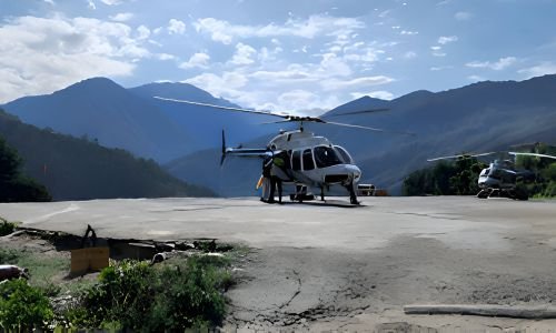 Beautiful white helicopter parked at Guptkashi helipad, ready for the Guptkashi to Kedarnath journey.